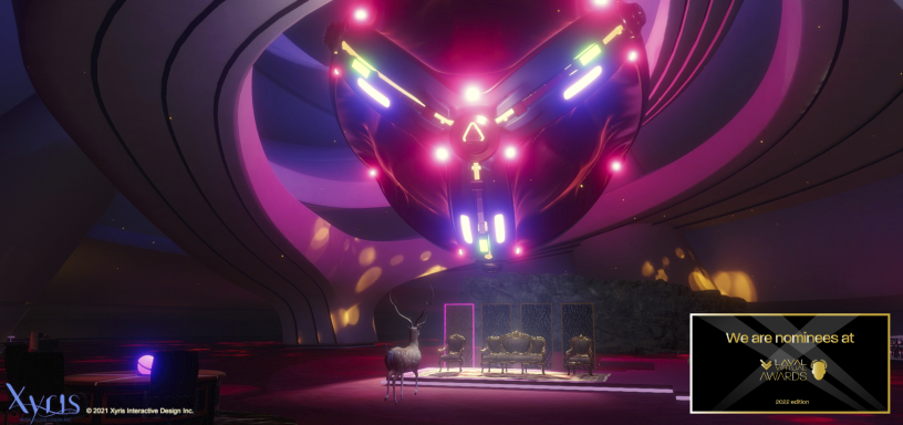 A giant robot face is suspended above a stage with antique chairs. The chairs are lit by a spotlight from the robot. An elk stands in front of the stage.